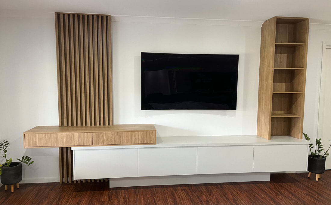Custom entertainment unit with a timber batten wall and open shelving