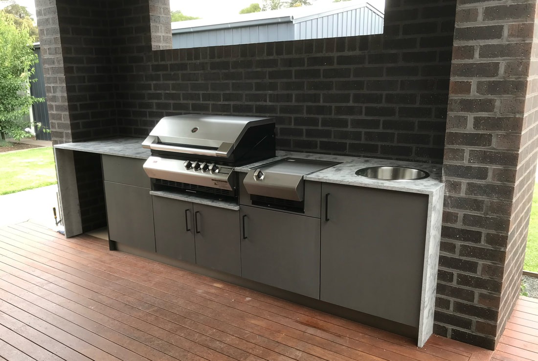 Outdoor alfresco kitchen and barbecue cabinetry